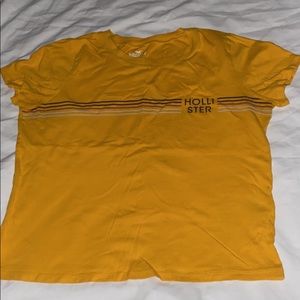 yellow striped shirt with Hollister logo